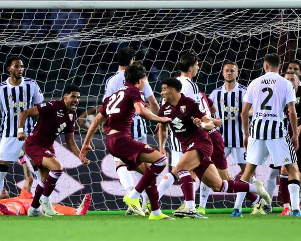 Che Adams celebrates scoring a late equaliser for Torino against Juventus at the Olympic Grande Torino Stadium. (Photo by MARCO BERTORELLO / AFP via Getty Images)