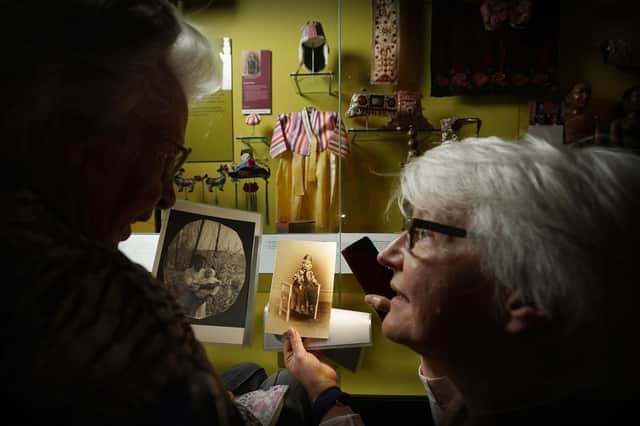 Dr Friederike Voigt reuniting Mary Davidson Smith (left), 104, with the traditional Korean outfit she wore almost 100 years ago at the National Museum of Scotland.