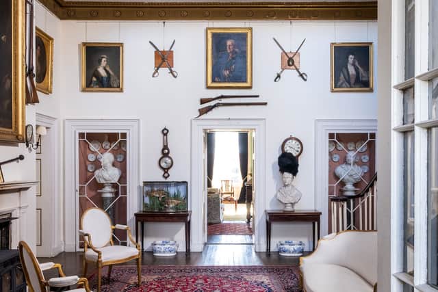 The Myrton Castle Suite. A George III carved giltwood suite to include a pair of sofas and a pair of armchairs.