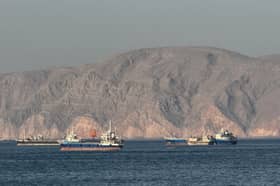 Vessels anchored in the Strait of Hormuz off Khasab, Oman, where an effective blockade is in place amid conflict between Iran and the US, damaging the global economy