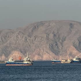 Vessels anchored in the Strait of Hormuz off Khasab, Oman, where an effective blockade is in place amid conflict between Iran and the US, damaging the global economy