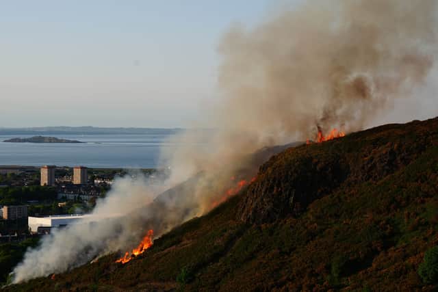 Flames and smoke rise from a fire close to the ruins of St Anthony's Chapel in Holyrood Park, Edinburgh.