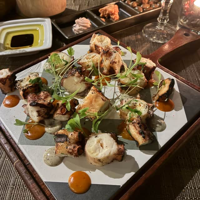 A starter of octopus served in a chequer board of styles at Paul De Lume restaurant in the Savoy Palace hotel.