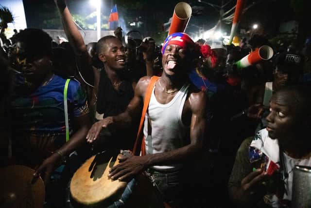 Fans cheer in the streets of Port-au-Prince after Haiti secure World Cup qualification