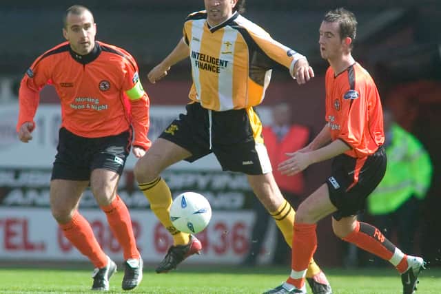 Hassan Kachloul is closely watched by United's Paul Richie (left) and Mark Kerr at Tannadice in April, 2005.