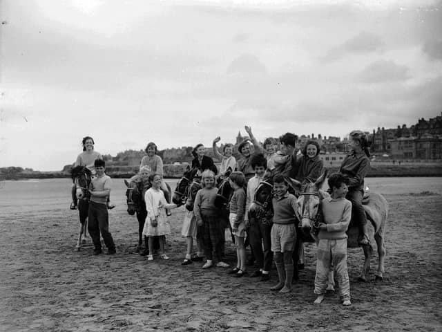 Children on donkeys at St Andrews Beach in July 1961.