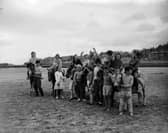 Children on donkeys at St Andrews Beach in July 1961.