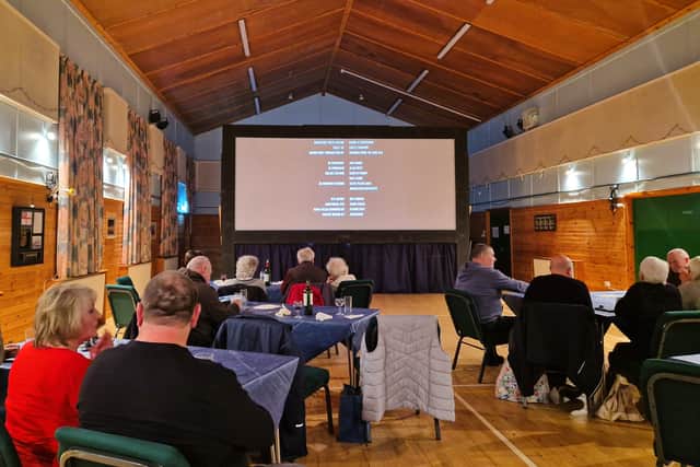 Enjoying a film screening with locals where I unexpectedly picked up a host