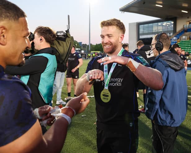 Glasgow Warriors captain Kyle Steyn, with his player of the match medal, celebrates with Sione Tuipulotu after the win over Connacht in the BKT United Rugby Championship quarter-final at Scotstoun.