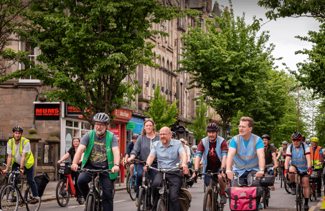 A coral-coloured Voi bike, left, among those being used by riders to reach the Pedal on Parliament rally in Edinburgh on Saturday