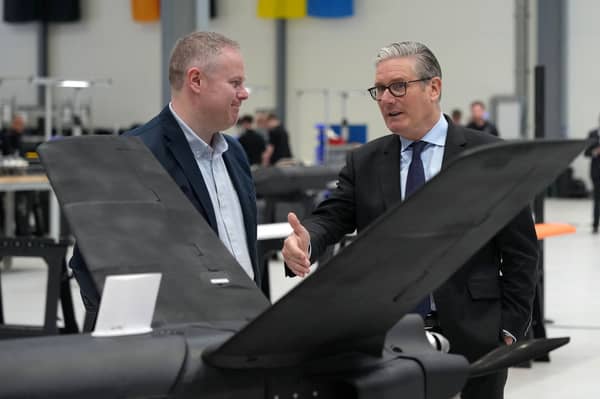Keir Starmer looks at drones as he visits defence contractor Stark in Swindon yesterday (Picture: Alastair Grant/pool)