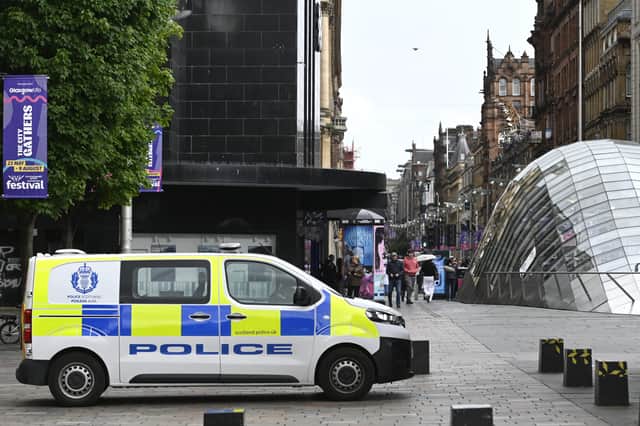 There was still a Police Scotland prescence in Glasgow city centre on Wednesday after the previous evening's unrest. Picture: John Devlin
