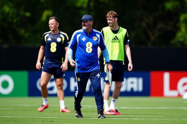 Scotland head coach Steve Clarke during a training session at the Atrium Health Training Ground in Charlotte, North Carolina, with Lawrence Shankland and Tyler Fletcher in the background.