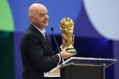 FIFA President Gianni Infantino holds the World Cup trophy while speaking during the World Cup International Broadcast Center Grand Opening ceremony on June 01, 2026 in Dallas, Texas. (Photo by Sam Hodde/Getty Images)