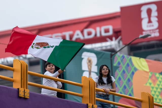 A child waves a Mexican flag outside Mexico City Stadium two days before the start of the 2026 World Cup. (Photo by Cristopher Rogel Blanquet/Getty Images)