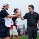 Bob MacIntyre shakes hands with caddie Mike Burrow at the end of the final round in last year’s US Open at Oakmont Country Club in Pennsylvania 