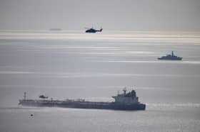 Military helicopters at the Russian shadow fleet oil tanker that was boarded by Royal Marine Commandos on Sunday