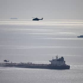 Military helicopters at the Russian shadow fleet oil tanker that was boarded by Royal Marine Commandos on Sunday