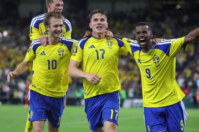 Nygren celebrates with Sweden teammates Alexander Isak and Viktor Gyokeres at the World Cup.