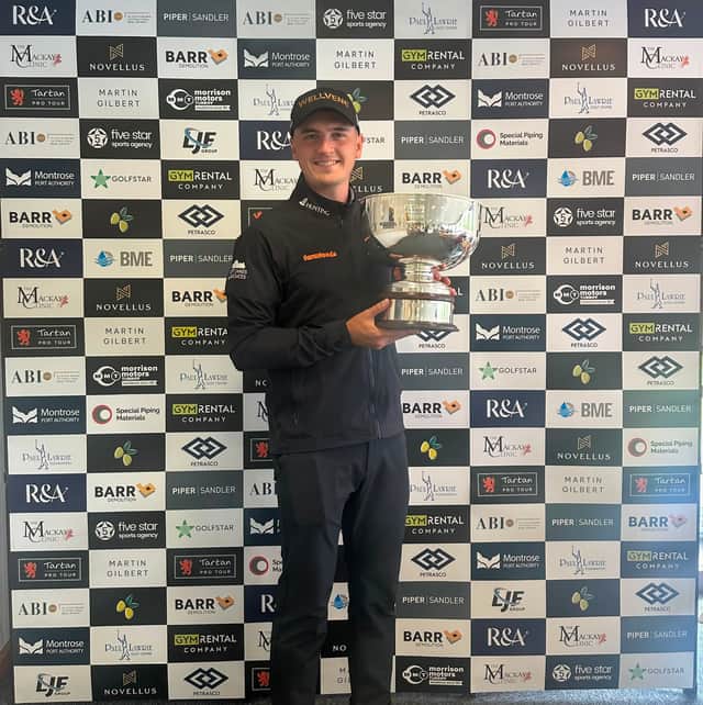 Sam Locke shows off the trophy after winning the Scottish Par 3 Championship at Paul Lawrie Golf Centre on the outskirts of Aberdeen