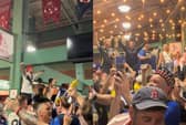 Scotland fans chant Super John McGinn at Fenway Park after watching the Boston Red Sox vs Texas Rangers game.