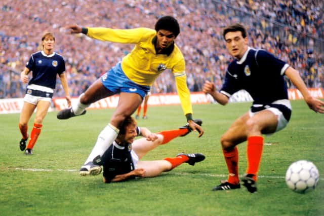 Paul McStay (right) previously held the record for Scotland's youngest World Cup player.