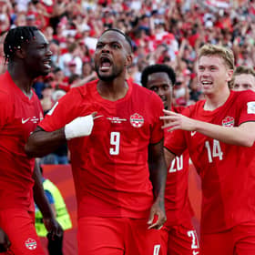 Cyle Larin celebrates with teammates after scoring for Canada during the team's first match against Bosnia and Herzegovina. 