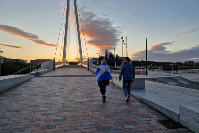 Scotland fans heading home across the Govan-Partick bridge over the Clyde in Glasgow at 4.45am on Sunday after the Haiti World Cup game