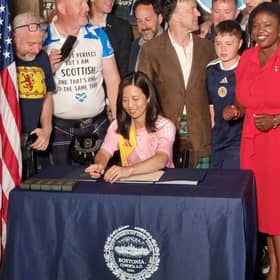 Mayor of Boston Michelle Wu (centre), who twinned Glasgow-Boston today at The Haven, a Scottish pub in Boston, during the 2026 World Cup.