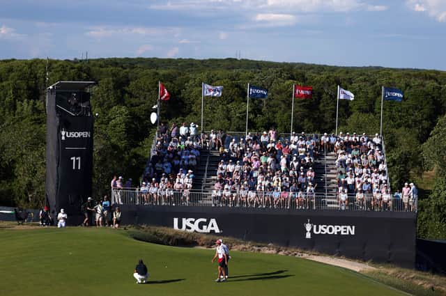 Bob MacIntyre spoke to a rules official at the side of the 11th green at Shinnecock Hills during the final round