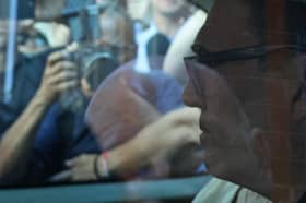 Andy Burnham, seen through the window of a taxi outside Euston Station on Monday, may have big plans but he will struggle to find the money to pay for them (Picture: Adrian Dennis)