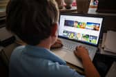 A 14-year-old boy using social media in Australia before the ban was introduced (Picture: David Gray)