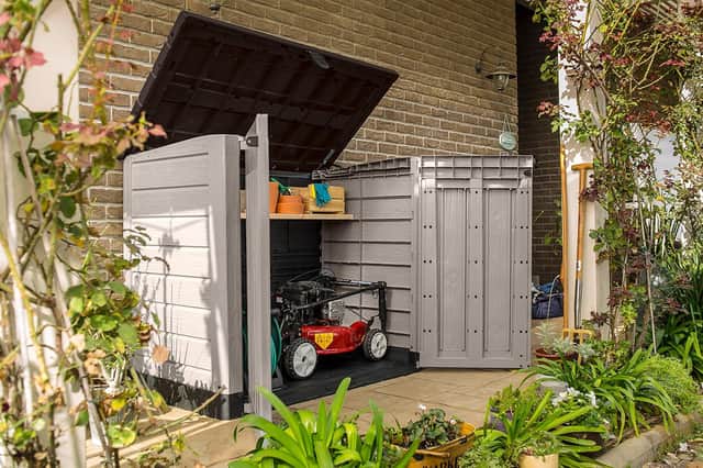 Beige and brown Keter Store It Out Pro outdoor garden storage unit with front doors and lifting lid