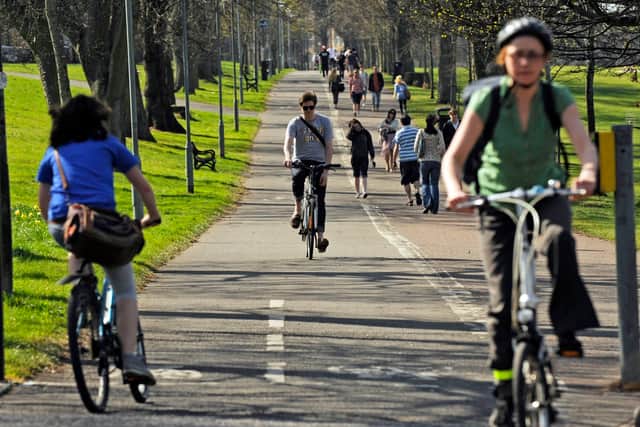 Cyclists and walkers on Middle Meadow Walk in Edinburgh