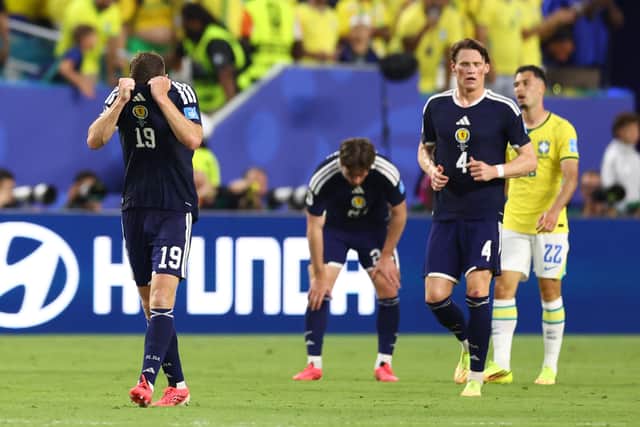 Scotland midfielder Lewis Ferguson reacts after the World Cup Group C defeat by Brazil at Miami Stadium. (Photo by Megan Briggs/Getty Images)