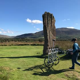 A researcher from Historic Environment Scotland explores the ground underneath Machrie Moor stone cirle on the Isle of Arran
