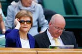 Peter Murrell, with his now estranged wife, Nicola Sturgeon, at the Wimbledon tennis championships in 2015 (Picture: Julian Finney)