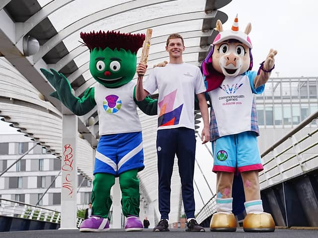 Duncan Scott with Team Scotland mascot Clyde, left, and 2026 Commonwealth Games mascot Finnie (Jane Barlow/PA)