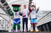 Duncan Scott with Team Scotland mascot Clyde, left, and 2026 Commonwealth Games mascot Finnie (Jane Barlow/PA)