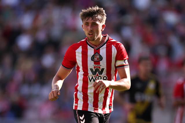 Rangers have signed former Sunderland captain Dan Neil on a three-year deal.