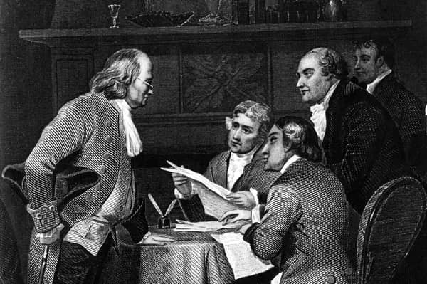 Benjamin Franklin, left, seen in a depiction of the drafting of the US Declaration of Independence in 1776, is said to have had dinner with Adam Smith during an earlier visit to Scotland (Image: Rischgitz)