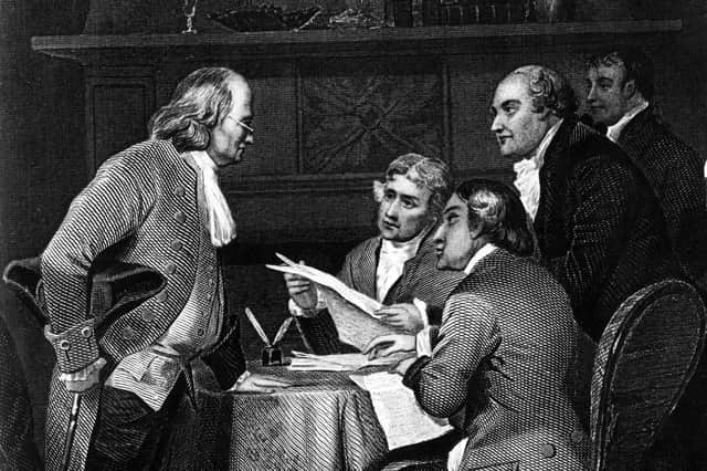 Benjamin Franklin, left, seen in a depiction of the drafting of the US Declaration of Independence in 1776, is said to have had dinner with Adam Smith during an earlier visit to Scotland (Image: Rischgitz)