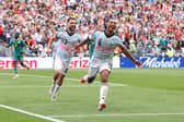 Rangers' Nico Raskin helps Belgium teammate Youri Tielemans celebrate his late winning goal against Senegal at the World Cup on Wednesday night. Cr: Getty Images.