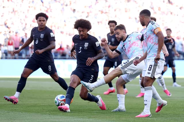 Raskin helps set up Belgium's first goal for Charles De Ketelaere.