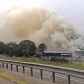 Smoke billows from a fire within an industrial estate in Tipperty, Ellon, Aberdeenshire on 7 July 2026.