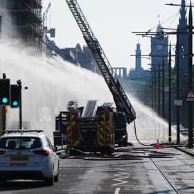 Firefighters at the scene of the blaze on Princes Street (Jane Barlow/PA)