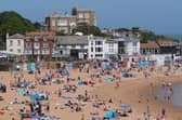 People enjoy the sun at Viking Bay, Broadstairs, Kent