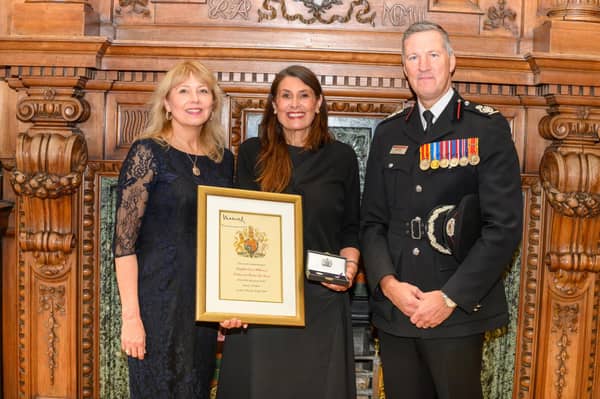 Depute Lord Provost Lezley Marion Cameron (left)  and Scottish Fire and Rescue Service Deputy Chief Officer Andy Watt as Rebecca Williamson is presented with the Elizabeth Emblem  posthumously awarded to firefighter Ewan Williamson, who died in the line of duty in July 2009.