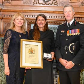 Depute Lord Provost Lezley Marion Cameron (left)  and Scottish Fire and Rescue Service Deputy Chief Officer Andy Watt as Rebecca Williamson is presented with the Elizabeth Emblem  posthumously awarded to firefighter Ewan Williamson, who died in the line of duty in July 2009.