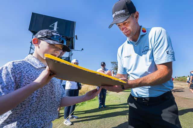 Justin Rose signs an autograph at Royal Birkdale, where he finished joint-fourth as an amateur in 1998